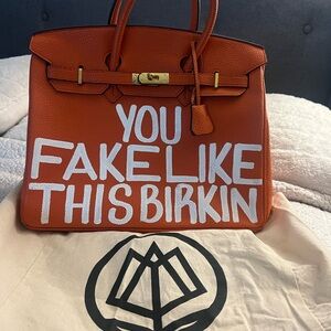Orange Handbag with Bold Text
